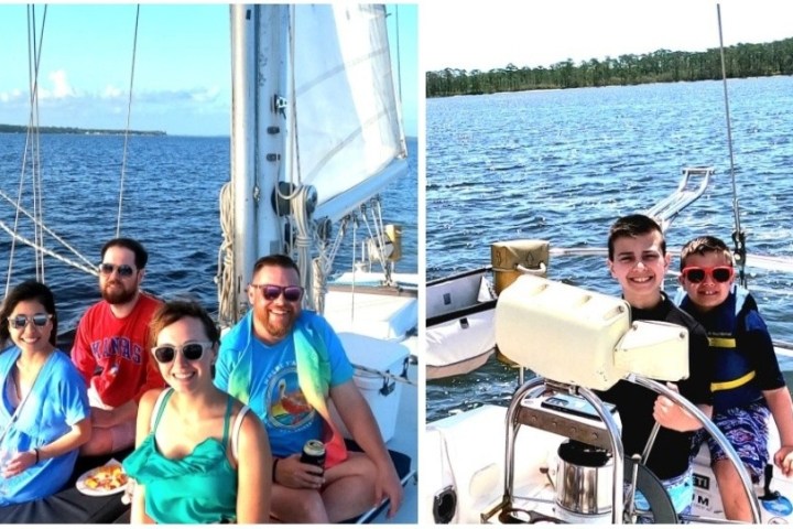 a group of people in a boat on a body of water